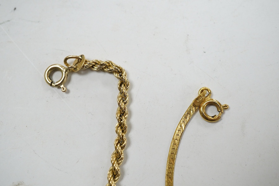 Four assorted 9ct gold chains or necklaces and a 9ct gold bar brooch, 14.7 grams. Condition - fair to good